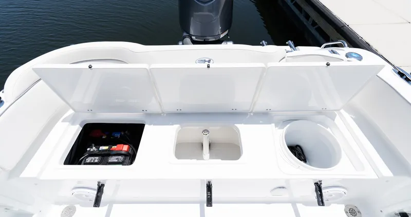 Slide: The Image of Storage compartments in the 2027 Sea Hunt Ultra 219 boat. - 15