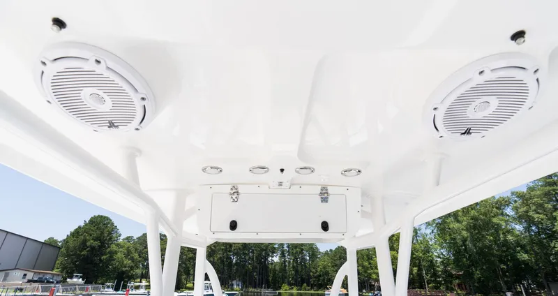 Slide: The Image of Interior view of Sea Hunt Ultra 219 boat roof with speakers, 2027 model. - 16