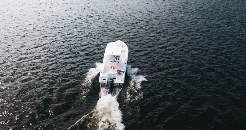Slide: The Image of Aerial view of Sea Hunt Ultra 219 boat on water, model year 2027. - 7
