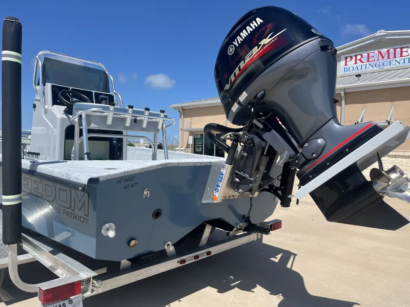 Slide: The Image of 2024 Freedom PATRIOT boat with Yamaha outboard motor. - 10