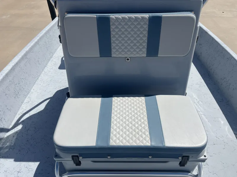Slide: The Image of 2024 Freedom PATRIOT boat seat with blue and white upholstery design. - 18