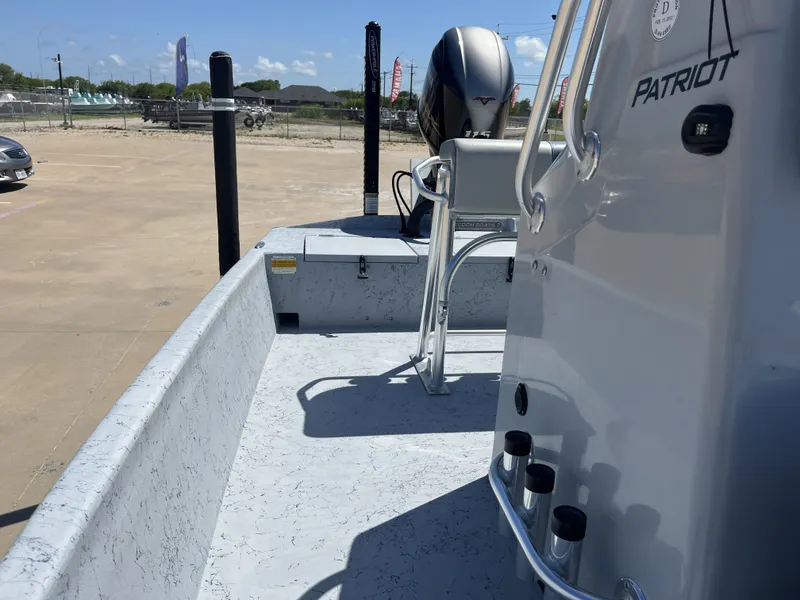 Slide: The Image of 2024 Freedom PATRIOT boat with outboard motor on parking lot. - 20