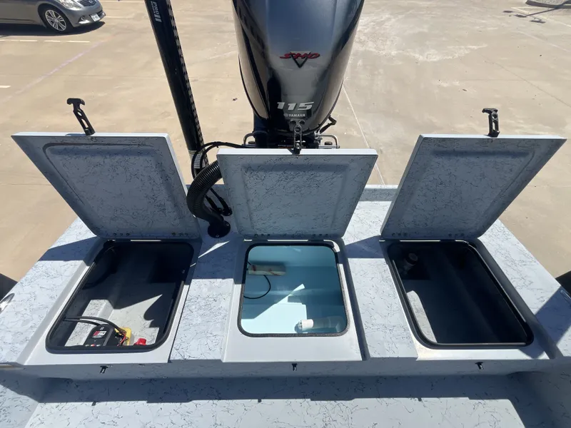 Slide: The Image of 2024 Freedom PATRIOT boat with open storage compartments and Yamaha motor. - 22