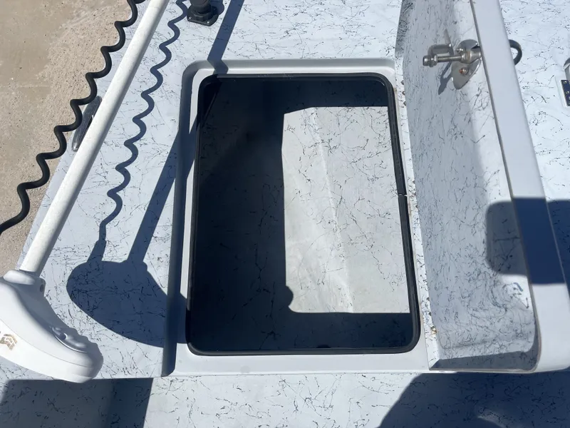 Slide: The Image of Open storage compartment on a 2024 Freedom PATRIOT boat. - 14
