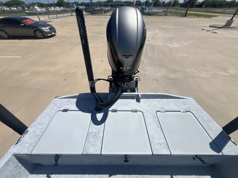 Slide: The Image of 2024 Freedom PATRIOT boat with Yamaha 115 engine on parking lot. - 21