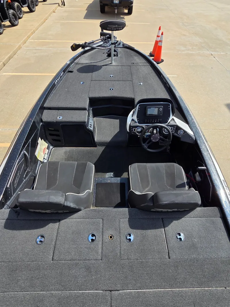 Slide: The Image of Interior view of a 2023 Skeeter ZX 150 boat with steering console. - 10