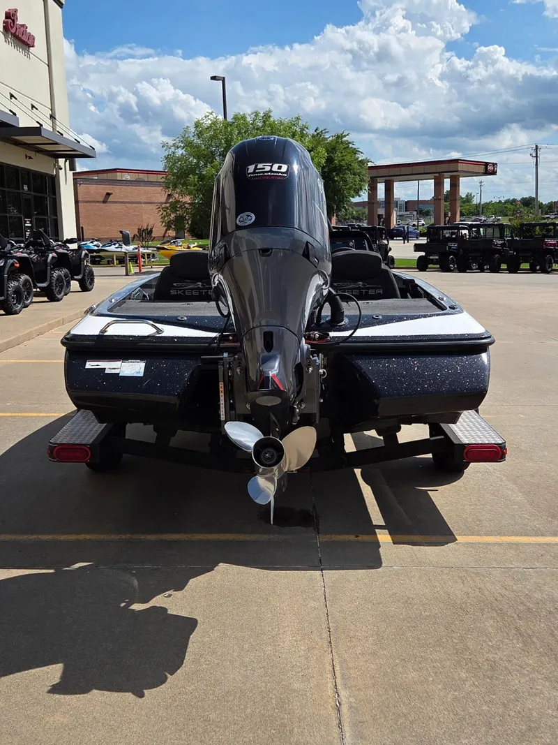 Slide: The Image of 2023 Skeeter ZX 150 boat with outboard motor in parking lot. - 7