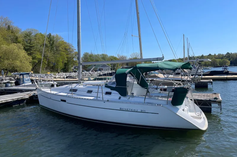 The Image of 2003 Beneteau Oceanis Clipper 311 sailboat docked at marina. - 0