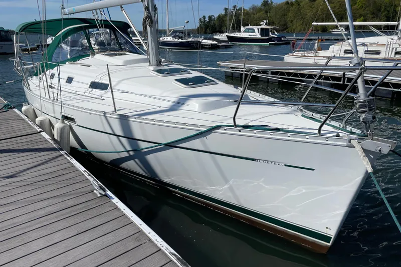 Slide: The Image of 2003 Beneteau Oceanis Clipper 311 sailboat docked at marina, sunny day. - 3