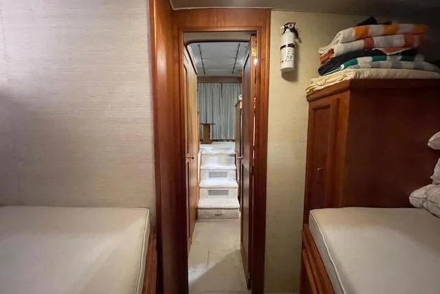 Slide: The Image of Interior of 1984 Egg Harbor 33 Convertible yacht with wooden finishes and cozy sleeping quarters. - 27
