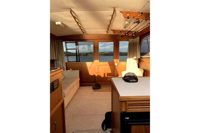 Slide: The Image of Interior of 1984 Egg Harbor 33 Convertible boat with scenic window view. - 36
