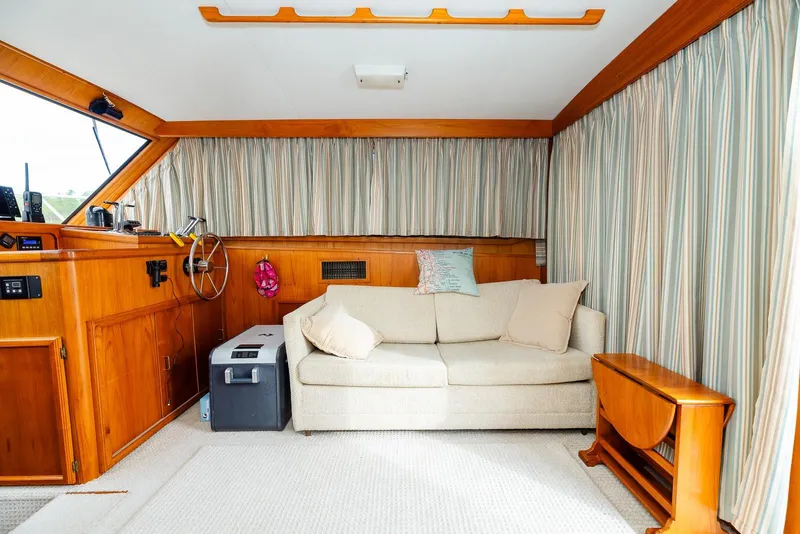 Slide: The Image of Interior of 1984 Egg Harbor 33 Convertible yacht with sofa and wooden accents. - 41