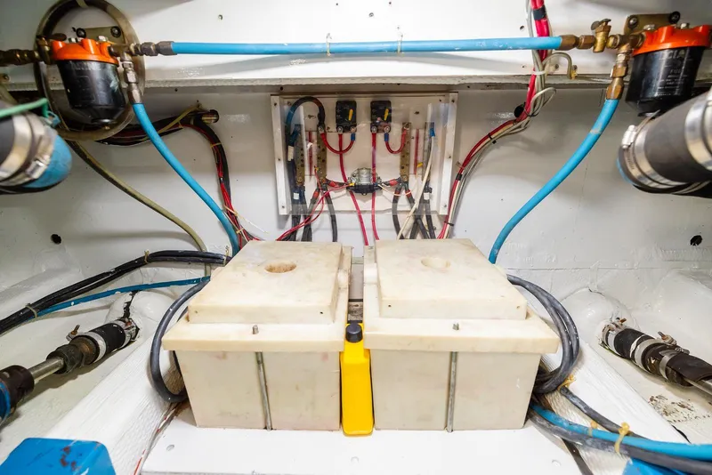 Slide: The Image of Engine room of 1984 Egg Harbor 33 Convertible with wiring and components. - 60