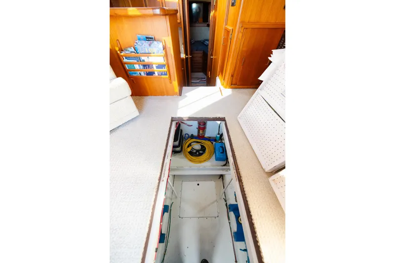 Slide: The Image of Interior view of 1984 Egg Harbor 33 Convertible yacht with open floor hatch. - 62