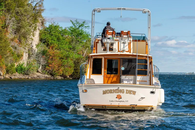 Slide: The Image of 1984 Egg Harbor 33 Convertible boat "Morning Dew" cruising on Lake Champlain, Vermont. - 65