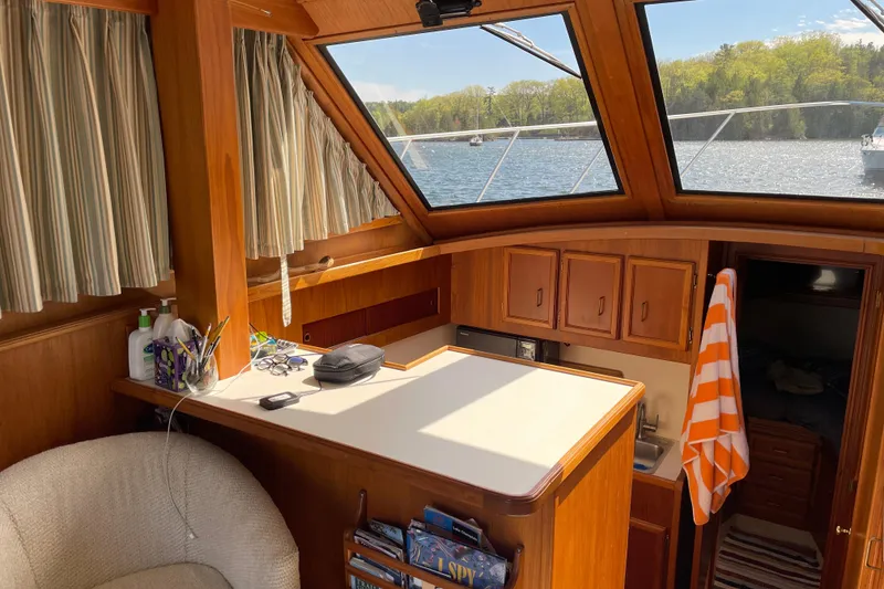 Slide: The Image of Interior of 1984 Egg Harbor 33 Convertible yacht with wood cabinetry and lake view. - 7