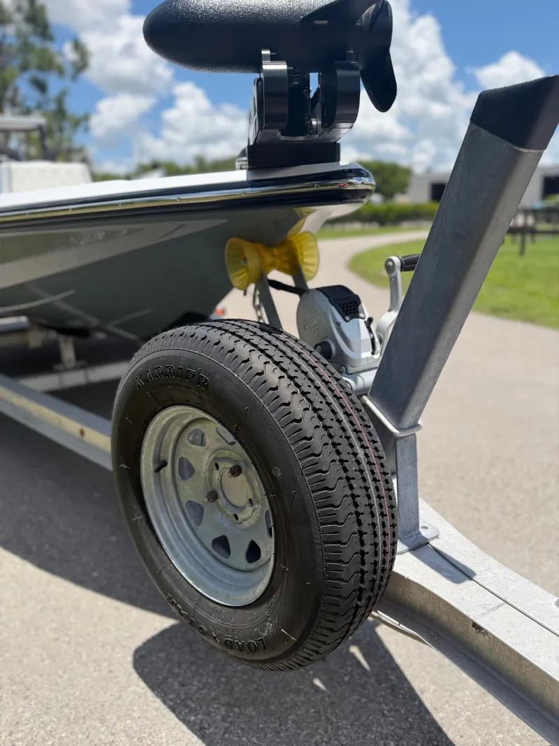 Slide: The Image of Close-up of a boat trailer with Back Country 171 Pro Guide, 1997 model. - 21