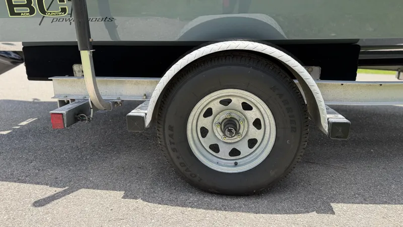 Slide: The Image of Trailer tire of a 1997 Back Country 171 Pro Guide boat. - 22