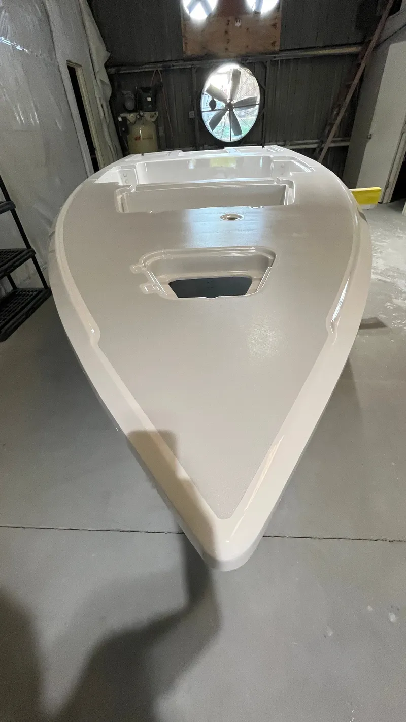 Slide: The Image of A 1997 Back Country 171 Pro Guide boat hull in a workshop, with no visible equipment. - 25