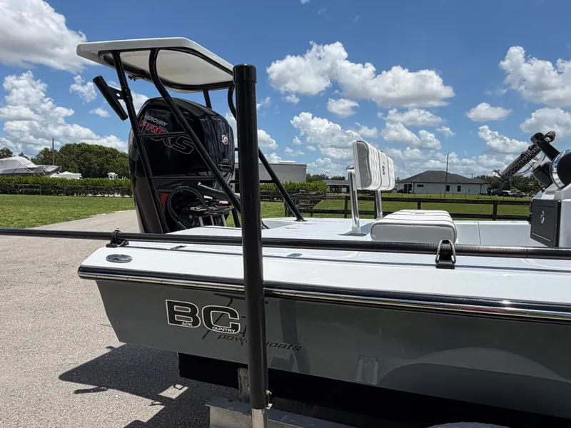 Slide: The Image of 1997 Back Country 171 Pro Guide boat with Mercury engine, sunny day. - 4