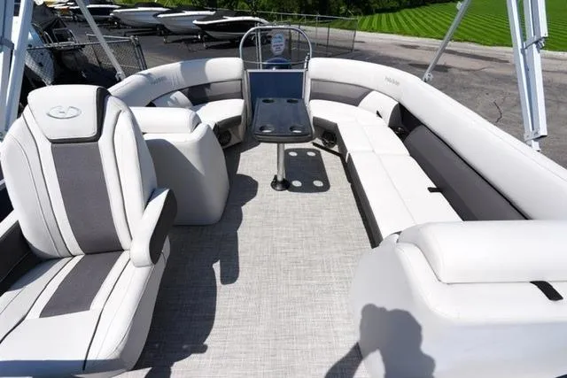 Slide: The Image of 2023 Harris Cruiser 230 CW pontoon boat interior with plush seating and modern design. - 12