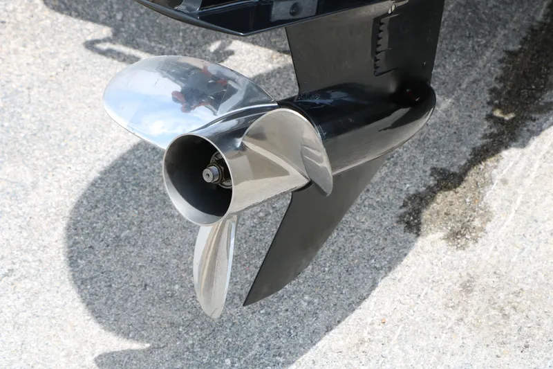 Slide: The Image of Close-up of a 2019 Vexus AVX 1980 boat propeller on pavement. - 10