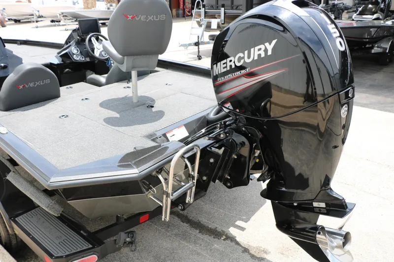 Slide: The Image of 2019 Vexus AVX 1980 boat with Mercury FourStroke engine, featuring spacious deck and seating. - 15
