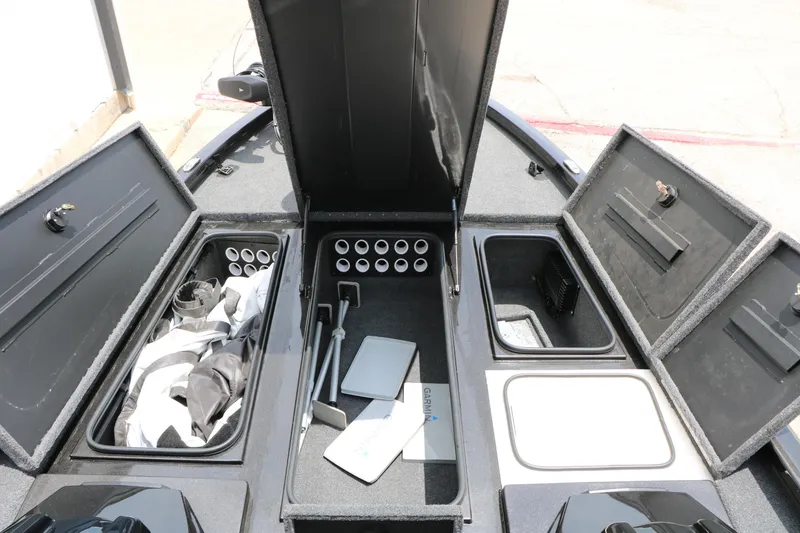 Slide: The Image of 2019 Vexus AVX 1980 boat storage compartments with organized fishing gear and equipment. - 21