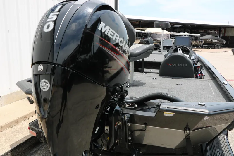 Slide: The Image of 2019 Vexus AVX 1980 boat with Mercury 150 engine, parked outdoors. - 9