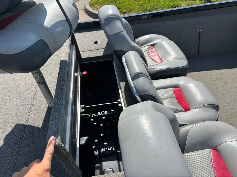 Slide: The Image of Interior of a 2012 Tracker Pro Team 190 TX boat with seating. - 15