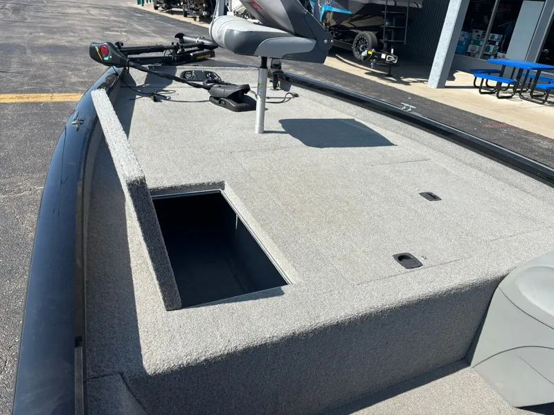Slide: The Image of 2012 Tracker Pro Team 190 TX boat with open storage compartment. - 19