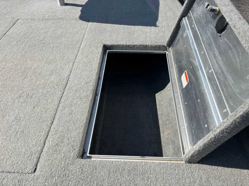 Slide: The Image of Open storage compartment in 2012 Tracker Pro Team 190 TX boat. - 20