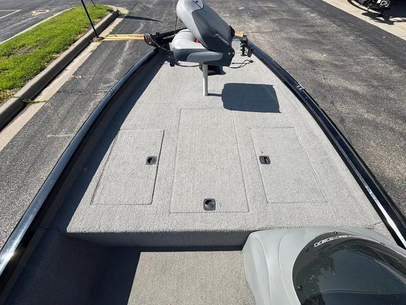 Slide: The Image of 2012 Tracker Pro Team 190 TX boat with gray carpeted deck. - 21