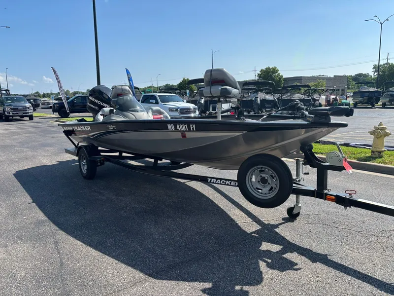 Slide: The Image of 2012 Tracker Pro Team 190 TX boat on trailer outdoors. - 26