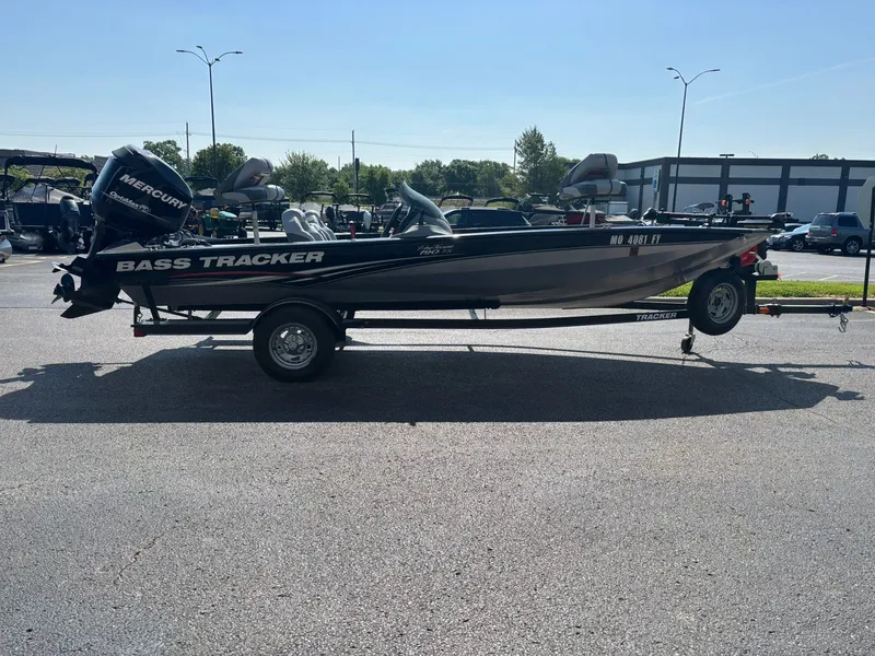Slide: The Image of 2012 Tracker Pro Team 190 TX boat on trailer outdoors. - 27