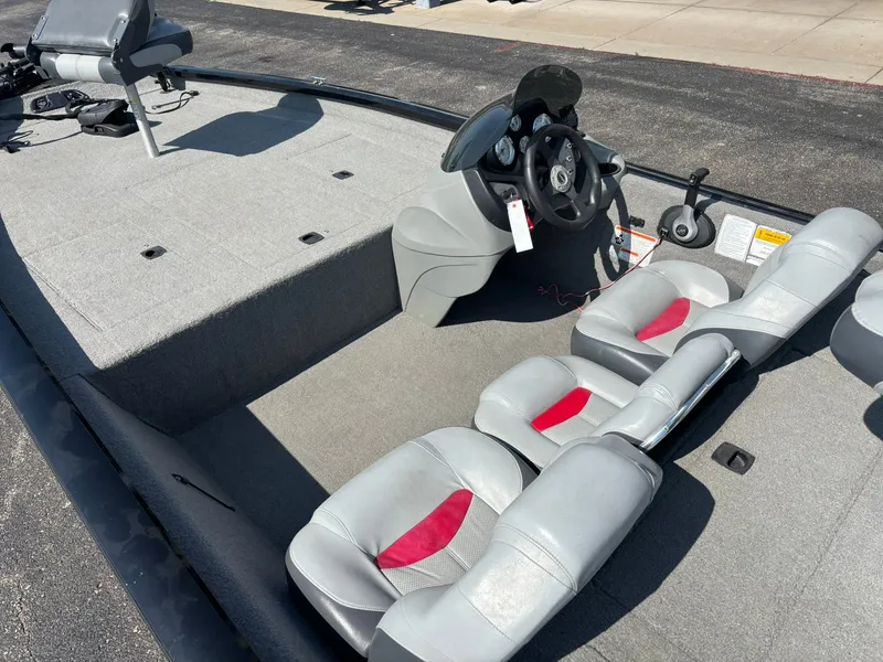 Slide: The Image of 2012 Tracker Pro Team 190 TX boat interior with gray seats. - 31