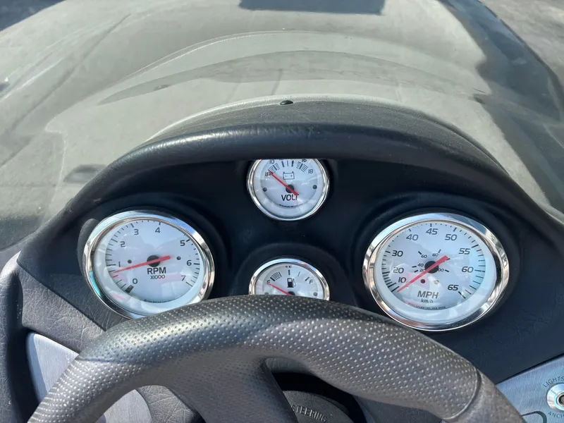 Slide: The Image of Dashboard of a 2012 Tracker Pro Team 190 TX boat. - 32