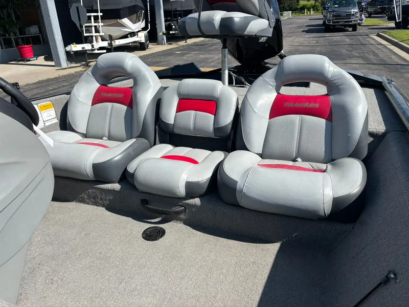 Slide: The Image of 2012 Tracker Pro Team 190 TX boat seats in gray and red. - 6