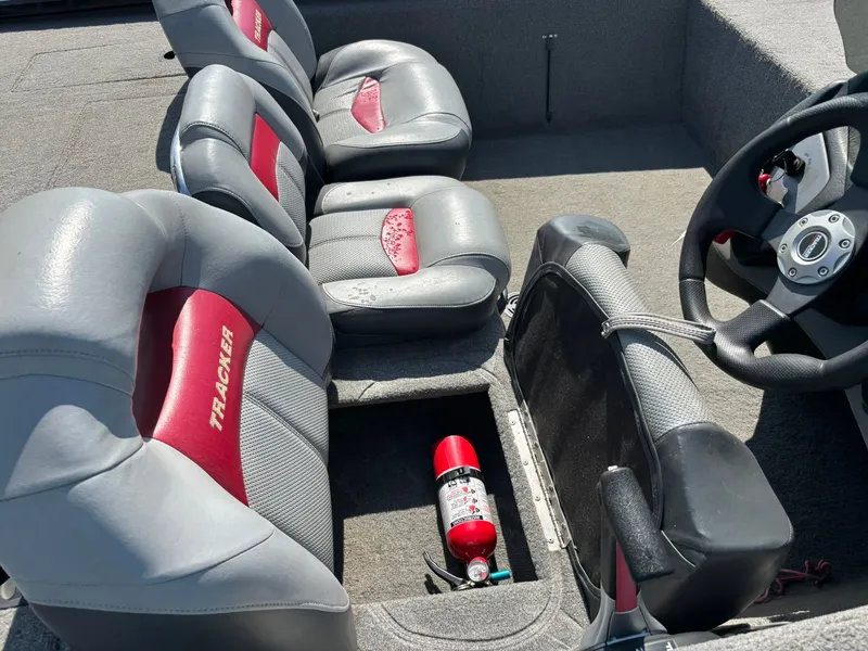 Slide: The Image of Interior of a 2012 Tracker Pro Team 190 TX boat with gray seats. - 9
