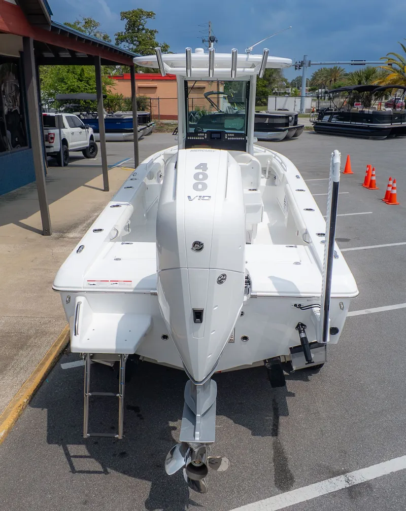 Slide: The Image of 2026 Everglades 253 Center Console boat parked at dock. - 3