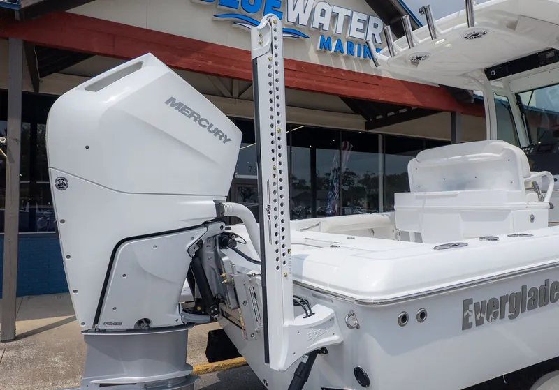 Slide: The Image of Everglades 253 Center Console 2026 with Mercury engine outside a marine store. - 5