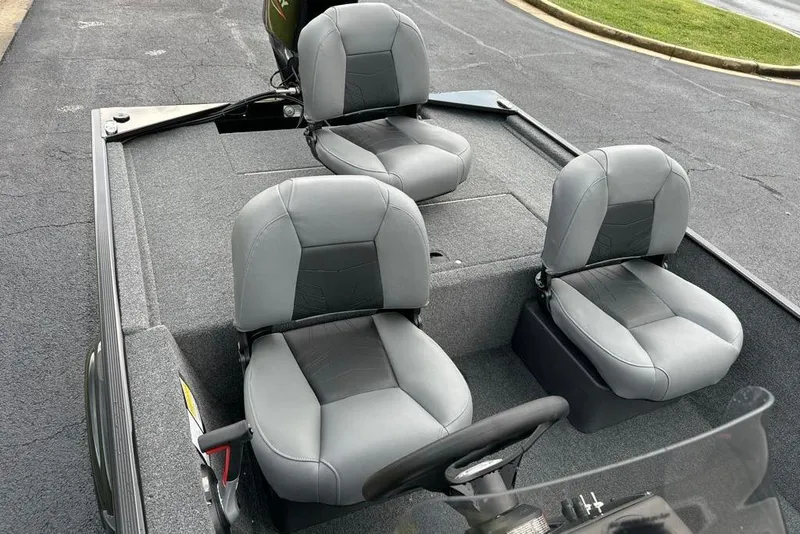 Slide: The Image of 2026 Tracker Bass Tracker Classic XL boat interior with three gray seats. - 7