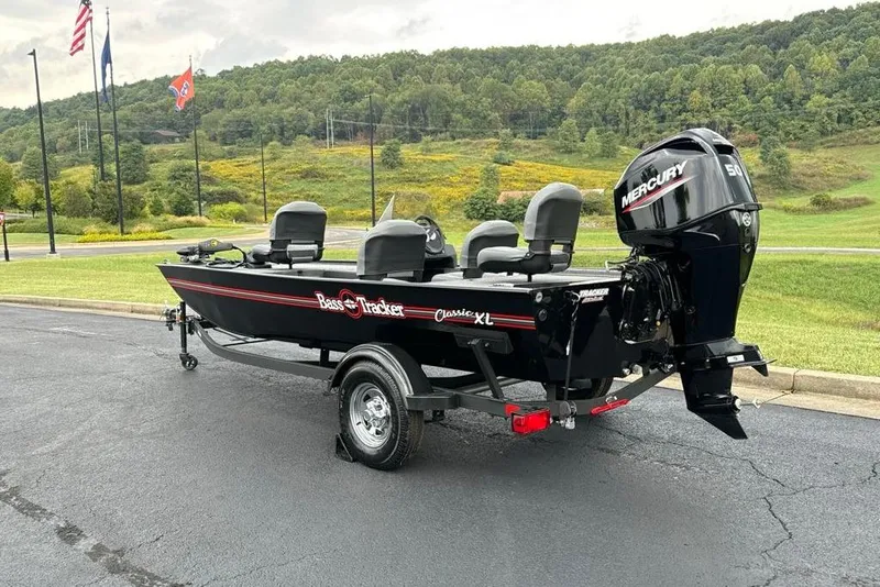 Slide: The Image of 2026 Tracker Bass Tracker Classic XL boat with Mercury engine on a trailer. - 5