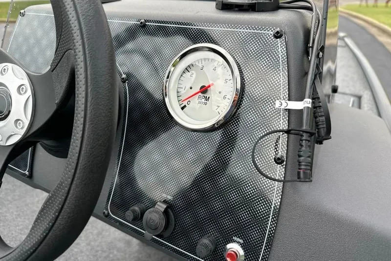 Slide: The Image of Dashboard of 2026 Tracker Bass Tracker Classic XL with RPM gauge and steering wheel. - 10