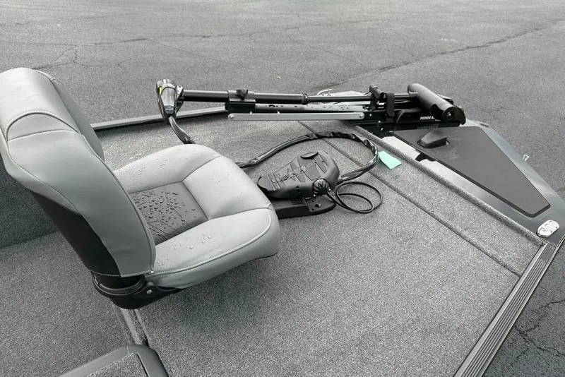 Slide: The Image of 2026 Tracker Bass Tracker Classic XL boat seat and trolling motor on deck. - 8