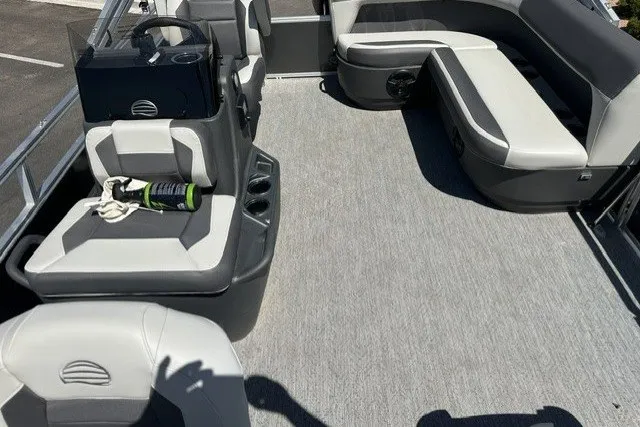 Slide: The Image of 2026 Sun Tracker Bass Buggy 16 XL Select pontoon boat interior with seating and storage. - 14