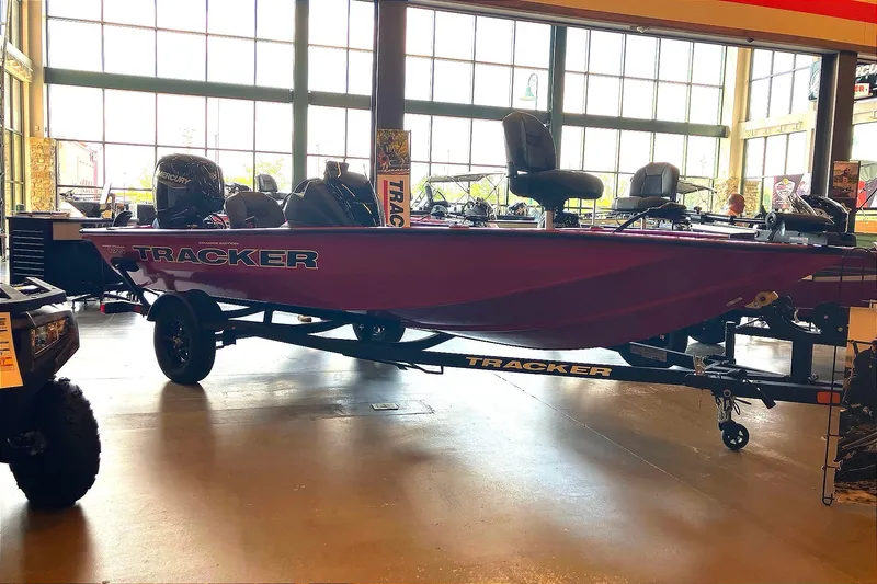 The Image of 2026 Tracker Pro Team 175 Crappie Edition boat displayed indoors on a trailer. - 0