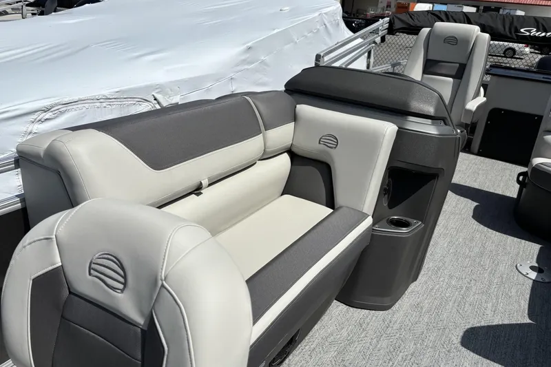 Slide: The Image of 2026 Sun Tracker Fishin' Barge 20 DLX interior with comfortable seating and modern design. - 4