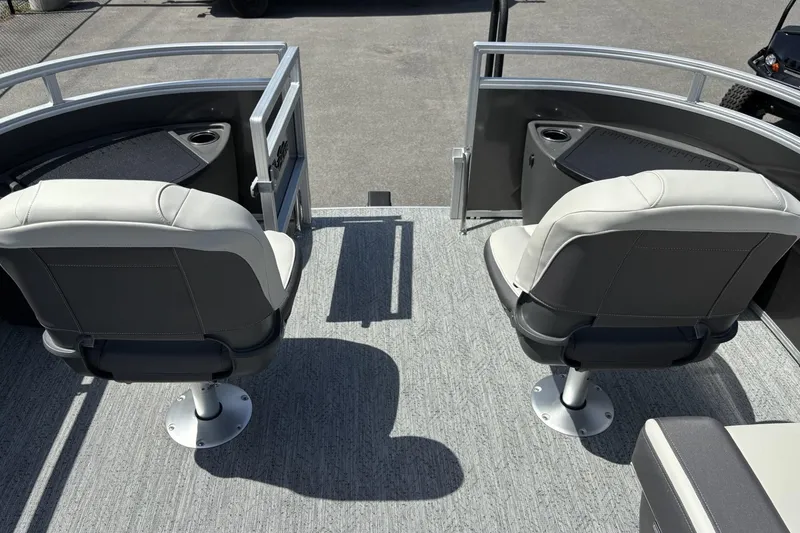 Slide: The Image of 2026 Sun Tracker Fishin' Barge 20 DLX with dual swivel seats and cup holders. - 8
