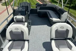 Slide: The Image of 2026 Sun Tracker Bass Buggy 16 XL Select pontoon boat interior with seating and helm. - 3